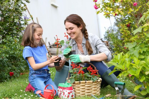 Gardeners Pinner adding neat detail and structure to a garden
